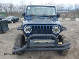 2004 Jeep Wrangler X with VIN 1J4FA39S64P780915, listed as a IAAI auction lot 42035524 with 131,057 mi miles. Bid and sale history available at carsss.com. Image 6.