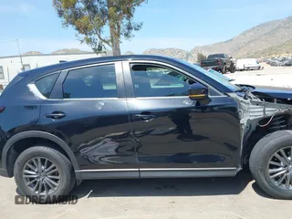 2019 Mazda CX-5 Sport with VIN JM3KFABM7K1509987, listed as a IAAI auction lot 42062804 with 50,898 mi miles and . Bid and sale history available at DreamBid. Image 14.