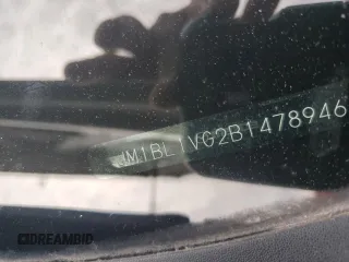 2011 Mazda 3 i Touring z VIN JM1BL1VG2B1478946, wystawiony jako Copart lot #58089435 z przebiegiem 90 895 mil mil oraz Szkoda całkowita • Salvage title. Historia ofert i sprzedaży dostępna na DreamBid. Obrazek 12.