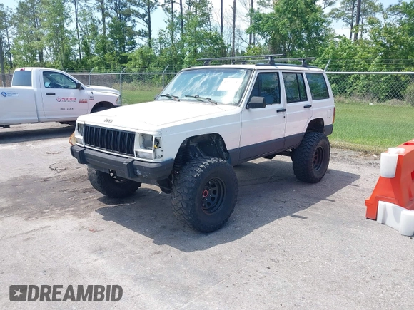 1996 Jeep Cherokee Country with VIN 1J4FJ78SXTL189940, listed as a IAAI auction lot 42020459 with 181,035 mi miles. Bid and sale history available at carsss.com. Image 2.