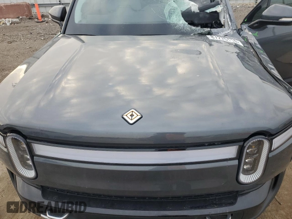2023 Rivian R1S Launch Edition with VIN 7PDSGABL9PN006743, listed as a Copart auction lot 87275114 with Not Provided miles and Salvage Title. Bid and sale history available at DreamBid. Image 12.