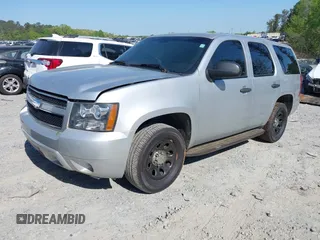 2013 Chevrolet Tahoe Commercial with VIN 1GNLC2E03DR124278, listed as a IAAI auction lot 39201429 with 182,584 mi miles and . Bid and sale history available at DreamBid. Image 2.