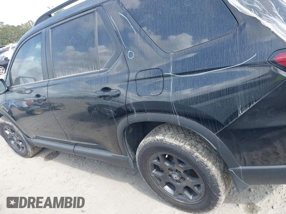 2025 Honda Pilot TrailSport with VIN 5FNYG1H61SB026477, listed as a IAAI auction lot 41471719 with 12,624 mi miles and . Bid and sale history available at DreamBid. Image 14.