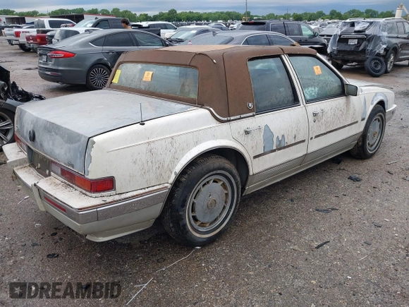 1990 Cadillac Seville z VIN 1G6KY533XLU803161, wystawiony jako IAAI lot #42164352 z przebiegiem Nie podano mil oraz . Historia ofert i sprzedaży dostępna na DreamBid. Obrazek 4.