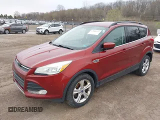 2014 Ford Escape SE with VIN 1FMCU0G99EUC38074, listed as a IAAI auction lot 42001227 with 209,467 mi miles. Bid and sale history available at carsss.com. Image 2.