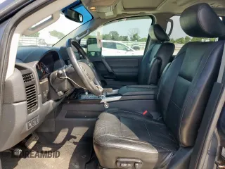 2013 Nissan Titan Pro-4X with VIN 1N6BA0EC3DN310741, listed as a Copart auction lot 57171975 with 146,524 mi miles and Salvage title. Bid and sale history available at DreamBid. Image 7.
