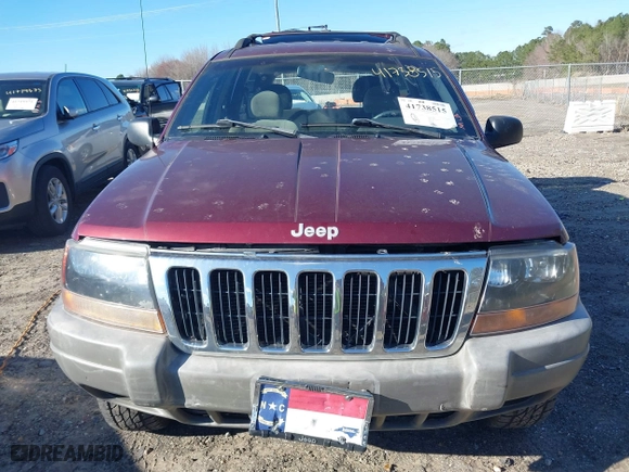 1999 Jeep Grand Cherokee Laredo with VIN 1J4GW58S5XC781472, listed as a IAAI auction lot 41738515 with 216,000 mi miles. Bid and sale history available at carsss.com. Image 12.