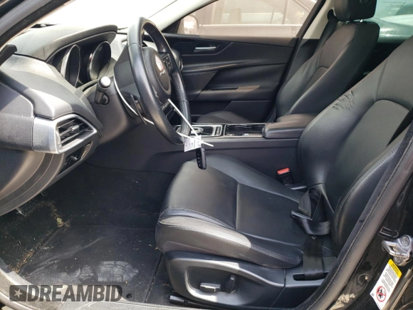 2017 Jaguar XE 25t with VIN SAJAR4BG6HA963018, listed as a Copart auction lot 52345325 with 107,626 mi miles and Salvage Title. Bid and sale history available at DreamBid. Image 7.