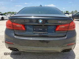 2019 BMW 5 Series M550i xDrive with VIN WBAJB9C51KB287797, listed as a Copart auction lot 65382465 with 61,459 mi miles and Salvage title. Bid and sale history available at DreamBid. Image 6.