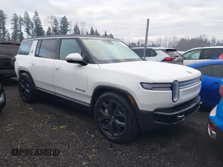 2025 Rivian R1S Adventure with VIN 7PDSGBBA3SN052257, listed as a IAAI auction lot 41289615 with 2,746 mi miles. Bid and sale history available at carsss.com. Image 1.