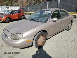 1999 Mercury Sable LS z VIN 1MEFM53S7XG602788, wystawiony jako Copart lot #76894294 z przebiegiem 186 315 mil mil oraz Szkody całkowita. Historia ofert i sprzedaży dostępna na DreamBid. Obrazek 1.