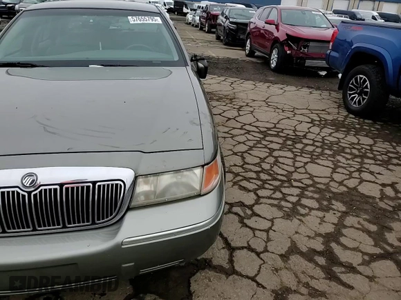 2000 Mercury Grand Marquis LS z VIN 2MEFM75WXYX742065, wystawiony jako Copart lot #57655795 z przebiegiem 175 070 mil mil oraz Tytuł czysty. Historia ofert i sprzedaży dostępna na DreamBid. Obrazek 13.