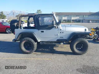 2005 Jeep Wrangler X with VIN 1J4FA39S55P348432, listed as a IAAI auction lot 41868451 with 166,876 mi miles. Bid and sale history available at carsss.com. Image 13.