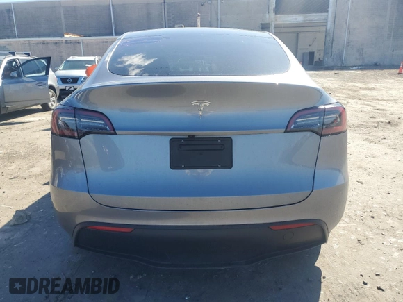 2025 Tesla Model Y Long Range with VIN 7SAYGDED0SF247561, listed as a Copart auction lot 50736875 with 9,094 mi miles and Salvage Title. Bid and sale history available at DreamBid. Image 6.