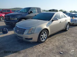 2009 Cadillac CTS RWD w/1SA with VIN 1G6DF577990141214, listed as a IAAI auction lot 42014205 with 237,986 mi miles. Bid and sale history available at carsss.com. Image 2.