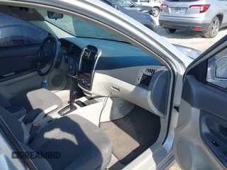 2006 Kia Spectra with VIN KNAFE161365208111, listed as a IAAI auction lot 41886193 with 292,535 mi miles. Bid and sale history available at carsss.com. Image 5.
