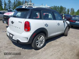2014 MINI Countryman S z VIN WMWZC5C52EWP39083, wystawiony jako IAAI lot #42409957 z przebiegiem 73 497 mil mil oraz . Historia ofert i sprzedaży dostępna na DreamBid. Obrazek 4.