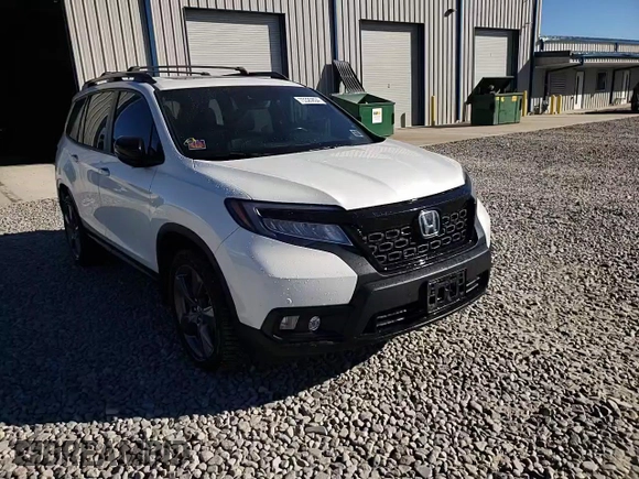 2020 Honda Passport Touring z VIN 5FNYF8H9XLB008647, wystawiony jako Copart lot #73320804 z przebiegiem 70 068 mil mil oraz Szkoda całkowita • Salvage title. Historia ofert i sprzedaży dostępna na DreamBid. Obrazek 11.