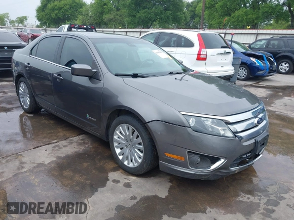 2012 Ford Fusion Hybrid z VIN 3FADP0L33CR289548, wystawiony jako IAAI lot #41905806 z przebiegiem 121 233 mil mil oraz . Historia ofert i sprzedaży dostępna na DreamBid. Obrazek 1.