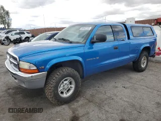 1999 Dodge Dakota SLT with VIN 1B7GG22Y7XS166815, listed as a Copart auction lot 48402125 with 176,458 mi miles and Salvage Title. Bid and sale history available at carsss.com. Image 1.