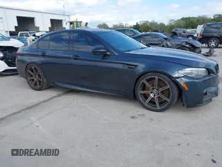 2013 BMW M5 with VIN WBSFV9C59DD096774, listed as a IAAI auction lot 41608286 with 82,601 mi miles. Bid and sale history available at carsss.com. Image 1.