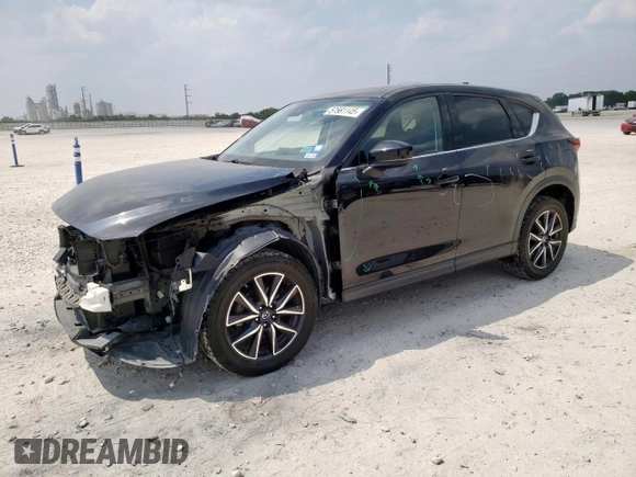 2018 Mazda CX-5 Grand Touring with VIN JM3KFBDM6J0414523, listed as a Copart auction lot 57581145 with 69,353 mi miles and Salvage title. Bid and sale history available at DreamBid. Image 1.
