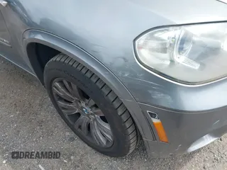2013 BMW X5 xDrive50i with VIN 5UXZV8C52D0C15272, listed as a IAAI auction lot 42644739 with 169,393 mi miles and . Bid and sale history available at DreamBid. Image 6.
