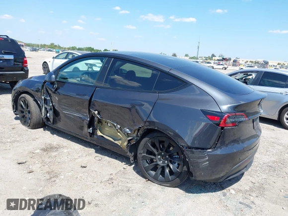 2024 Tesla Model Y with VIN 7SAYGDED3RF019063, listed as a IAAI auction lot 42061888 with 13,763 mi miles and . Bid and sale history available at DreamBid. Image 3.
