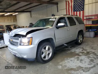 2012 Chevrolet Tahoe LTZ with VIN 1GNSKCE04CR272829, listed as a Copart auction lot 59959525 with 164,690 mi miles and Salvage title. Bid and sale history available at DreamBid. Image 1.
