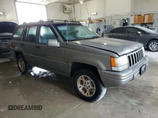 1998 Jeep Grand Cherokee Limited with VIN 1J4GZ78Y8WC285670, listed as a Copart auction lot 70213044 with 128,382 mi miles and Clean Title. Bid and sale history available at carsss.com. Image 4.