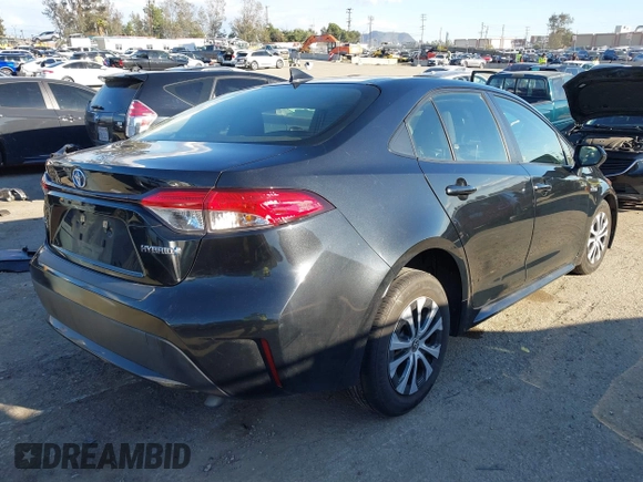 2021 Toyota Corolla Hybrid LE with VIN JTDEAMDE5MJ014959, listed as a IAAI auction lot 41751203 with 26,220 mi miles. Bid and sale history available at carsss.com. Image 4.