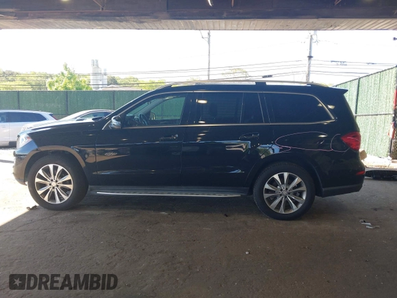 2014 Mercedes-Benz GL 450 z VIN 4JGDF7CE7EA395551, wystawiony jako IAAI lot #42247332 z przebiegiem 105 636 mil mil oraz . Historia ofert i sprzedaży dostępna na DreamBid. Obrazek 15.