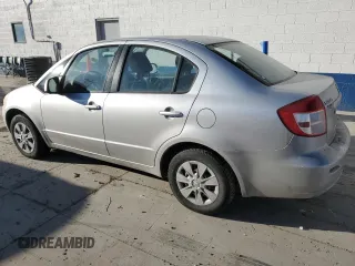 2010 Suzuki SX4 LE with VIN JS2YC5A27A6300498, listed as a Copart auction lot 43036655 with 237,647 mi miles and Salvage Title. Bid and sale history available at carsss.com. Image 2.