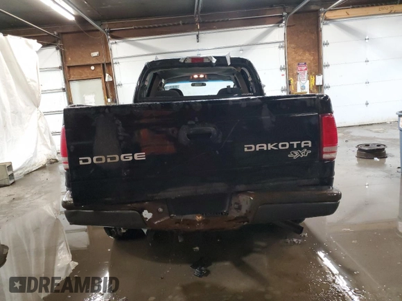 2004 Dodge Dakota Sport z VIN 1D7HG38KX4S782636, wystawiony jako Copart lot #88805195 z przebiegiem 151 620 mil mil oraz Szkoda całkowita • Salvage title. Historia ofert i sprzedaży dostępna na DreamBid. Obrazek 6.