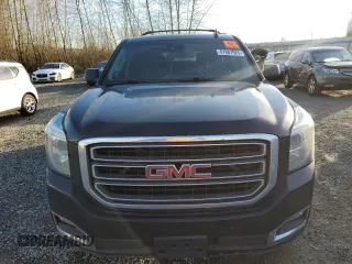 2015 GMC Yukon XL SLT with VIN 1GKS2HKC4FR697416, listed as a Copart auction lot 87887925 with 236,772 mi miles and Salvage Title. Bid and sale history available at carsss.com. Image 5.
