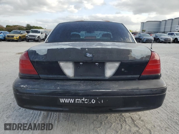 2005 Ford Police Interceptor with VIN 2FAFP71W35X128684, listed as a Copart auction lot 54002165 with 144,766 mi miles and Clean title. Bid and sale history available at DreamBid. Image 6.