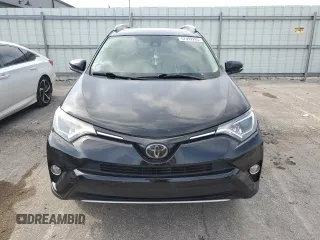 2018 Toyota RAV4 XLE with VIN 2T3WFREV3JW469307, listed as a Copart auction lot 57092295 with 47,639 mi miles and Salvage title. Bid and sale history available at DreamBid. Image 5.