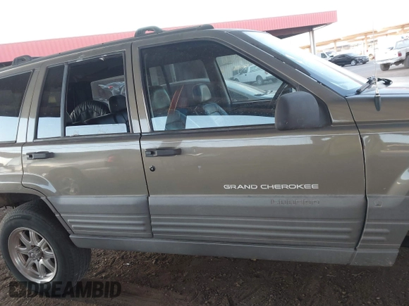 1998 Jeep Grand Cherokee Laredo with VIN 1J4GZ58S9WC136684, listed as a IAAI auction lot 41444103 with 1 mi miles. Bid and sale history available at carsss.com. Image 12.