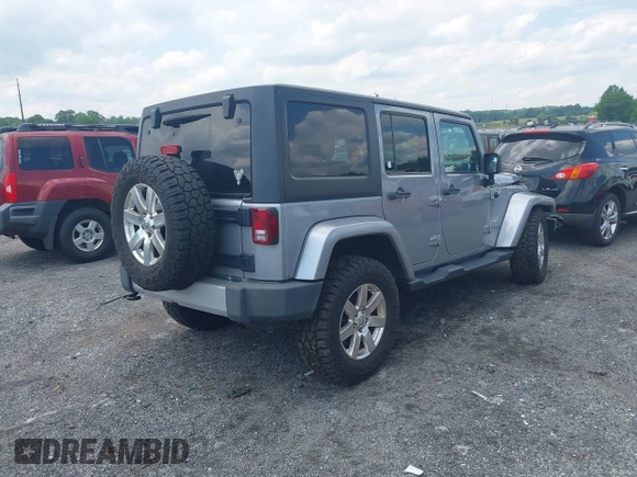 2014 Jeep Wrangler Unlimited Sahara z VIN 1C4BJWEG0EL129229, wystawiony jako IAAI lot #42380976 z przebiegiem 175 735 mil mil oraz . Historia ofert i sprzedaży dostępna na DreamBid. Obrazek 4.