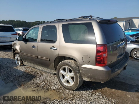 2011 Chevrolet Tahoe LS with VIN 1GNSCAE00BR395849, listed as a Copart auction lot 54750685 with 183,336 mi miles and Salvage title. Bid and sale history available at DreamBid. Image 2.