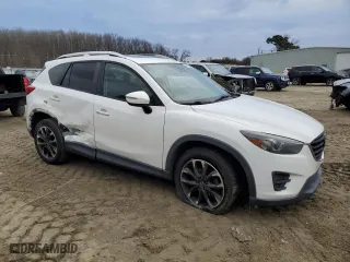2016 Mazda CX-5 Grand Touring with VIN JM3KE2DY2G0860473, listed as a Copart auction lot 41800395 with 132,293 mi miles and Salvage Title. Bid and sale history available at carsss.com. Image 4.