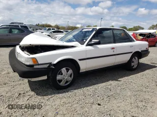 1989 Toyota Camry z VIN JT2SV21E0K3349573, wystawiony jako Copart lot #51115505 z przebiegiem 111 219 mil mil oraz Szkoda całkowita • Salvage title. Historia ofert i sprzedaży dostępna na DreamBid. Obrazek 1.