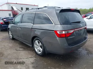 2013 Honda Odyssey Touring with VIN 5FNRL5H94DB013310, listed as a IAAI auction lot 42079565 with 128,622 mi miles and . Bid and sale history available at carsss.com. Image 3.