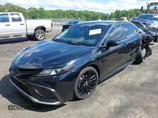 2022 Toyota Camry TRD with VIN 4T1KZ1AK2NU064511, listed as a IAAI auction lot 42176608 with 28,064 mi miles and . Bid and sale history available at DreamBid. Image 2.