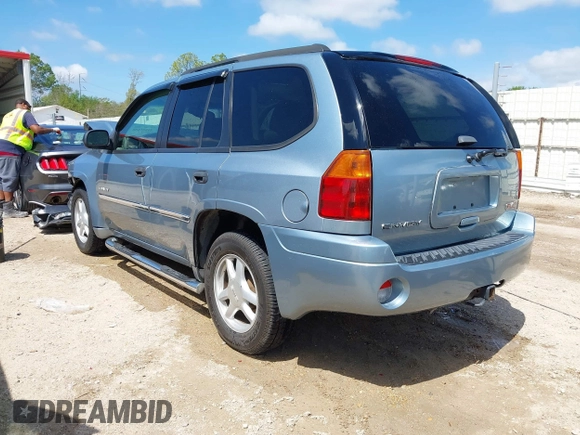 2006 GMC Envoy SLE with VIN 1GKDS13S362310613, listed as a IAAI auction lot 41881880 with 202,893 mi miles. Bid and sale history available at carsss.com. Image 3.