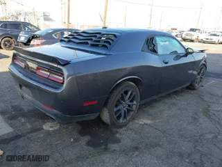 2021 Dodge Challenger GT with VIN 2C3CDZKG4MH677574, listed as a IAAI auction lot 41460036 with 67,170 mi miles. Bid and sale history available at carsss.com. Image 4.