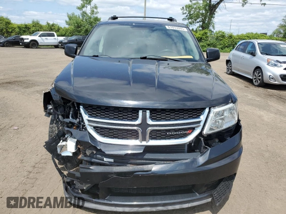 2013 Dodge Journey SE with VIN 3C4PDCAB0DT500365, listed as a Copart auction lot 61033665 with 193,231 mi miles and Salvage title. Bid and sale history available at DreamBid. Image 5.