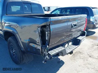 2019 Toyota Tacoma 4WD SR with VIN 3TMCZ5AN9KM275537, listed as a IAAI auction lot 41694037 with 102,933 mi miles. Bid and sale history available at carsss.com. Image 17.