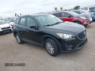2016 Mazda CX-5 Sport with VIN JM3KE2BY4G0761933, listed as a IAAI auction lot 41709274 with 131,127 mi miles. Bid and sale history available at carsss.com. Image 1.
