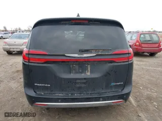 2023 Chrysler Pacifica Hybrid Touring L with VIN 2C4RC1L7XPR518209, listed as a IAAI auction lot 41038104 with 35,969 mi miles. Bid and sale history available at carsss.com. Image 16.
